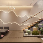 Minimalist dining space with a wooden table, floating staircase, and indoor greenery.