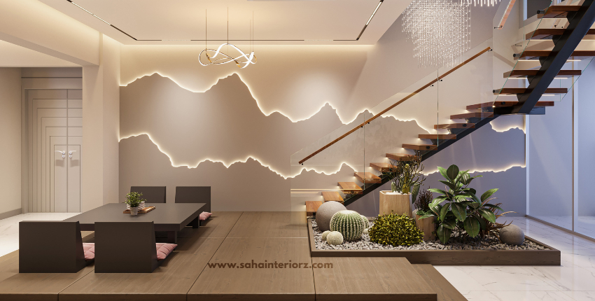 Minimalist dining space with a wooden table, floating staircase, and indoor greenery.